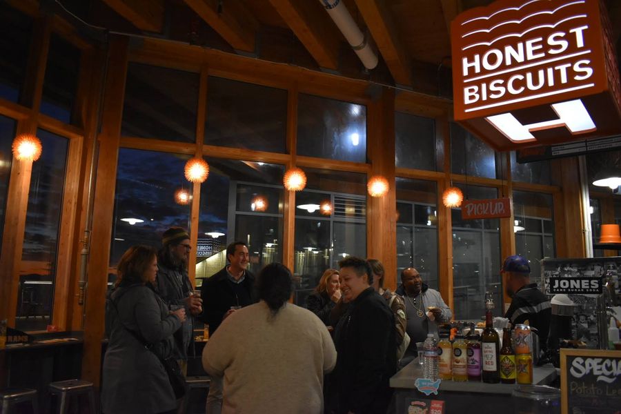 A crowd of people inside a restaurant.