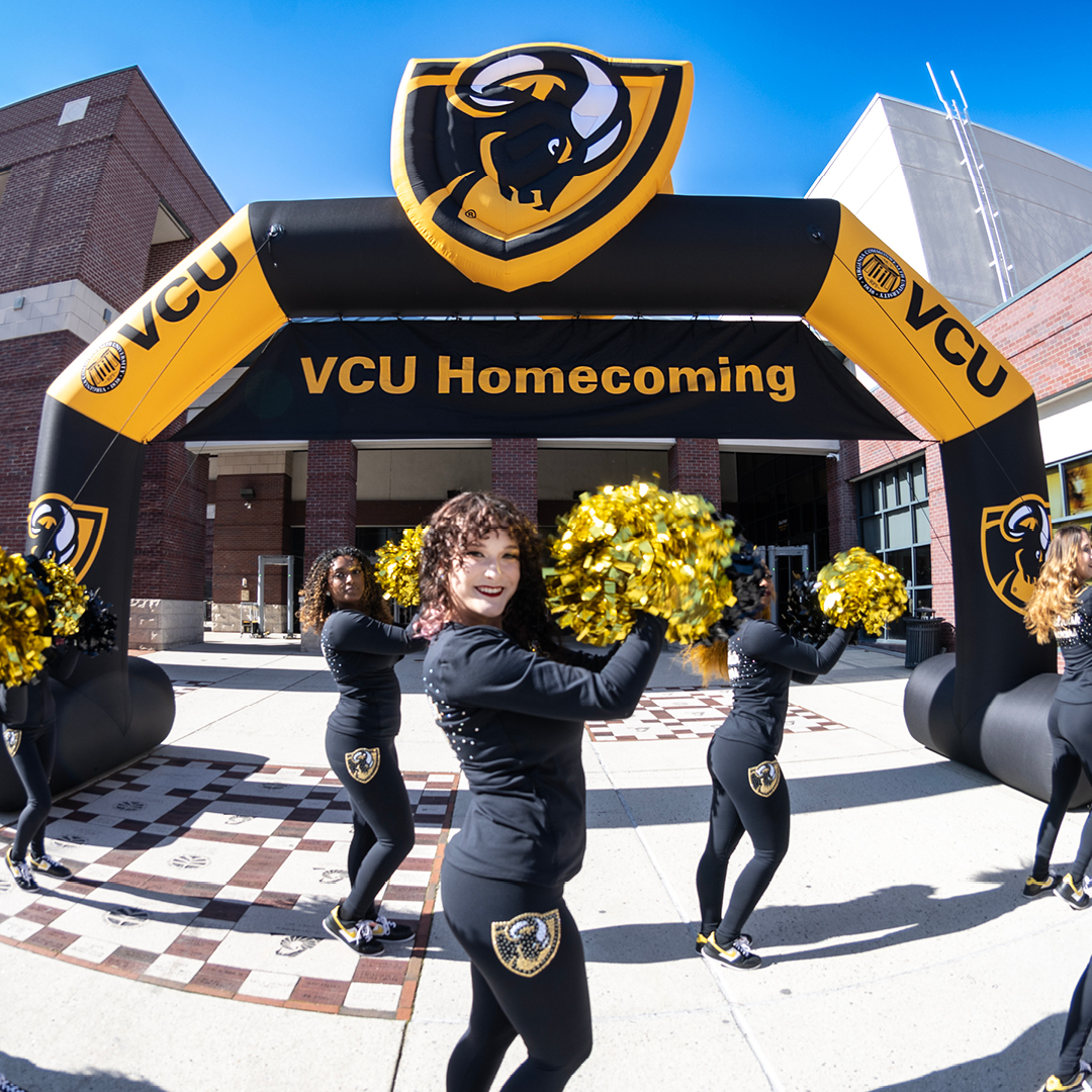 VCU cheerleading squad with pom poms