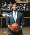 An image of alumnus and 10 Under 10 award winter David Hinton holding a basketball and standing on the floor of the court